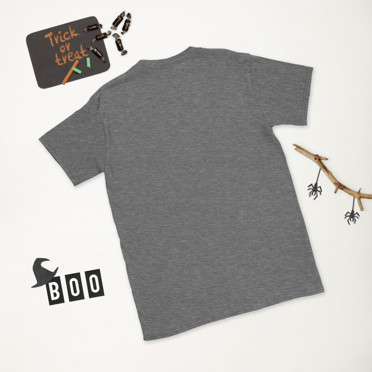 Plain back of heathered dark gray Bonsai Life Co. T-shirt in a white Halloween flat lay