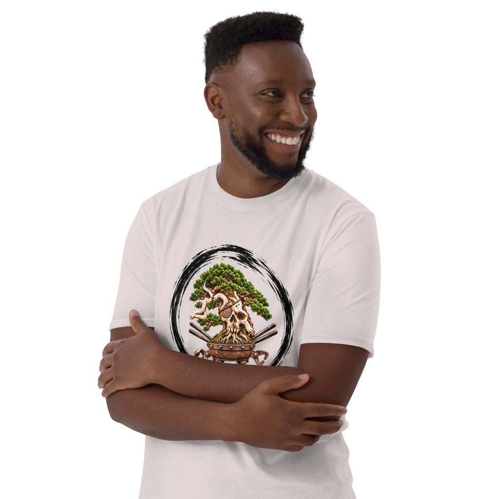 Model wearing pale gray T-shirt with green bonsai and pirate skull graphic inside a black circle with Bonsai Life Co. lettering, arms-crossed close view