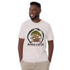 Model wearing pale gray T-shirt with green bonsai and pirate skull graphic inside a black circle with Bonsai Life Co. lettering, front view