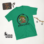 bright green T-shirt with green bonsai and pirate skull graphic inside a black circle with Bonsai Life Co. lettering, white Halloween flat lay