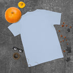 Plain back of light blue Bonsai Life Co. T-shirt in a gray flat lay with pumpkins