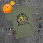 muted olive green T-shirt with green bonsai and pirate skull graphic inside a black circle with Bonsai Life Co. lettering, gray flat lay with pumpkins