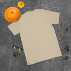 Plain back of sand beige Bonsai Life Co. T-shirt in a gray flat lay with pumpkins