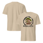Front and back of sand beige T-shirt with green bonsai and pirate skull graphic inside a black circle with Bonsai Life Co. lettering on front and plain back
