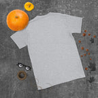 Plain back of heathered light gray Bonsai Life Co. T-shirt in a gray flat lay with pumpkins