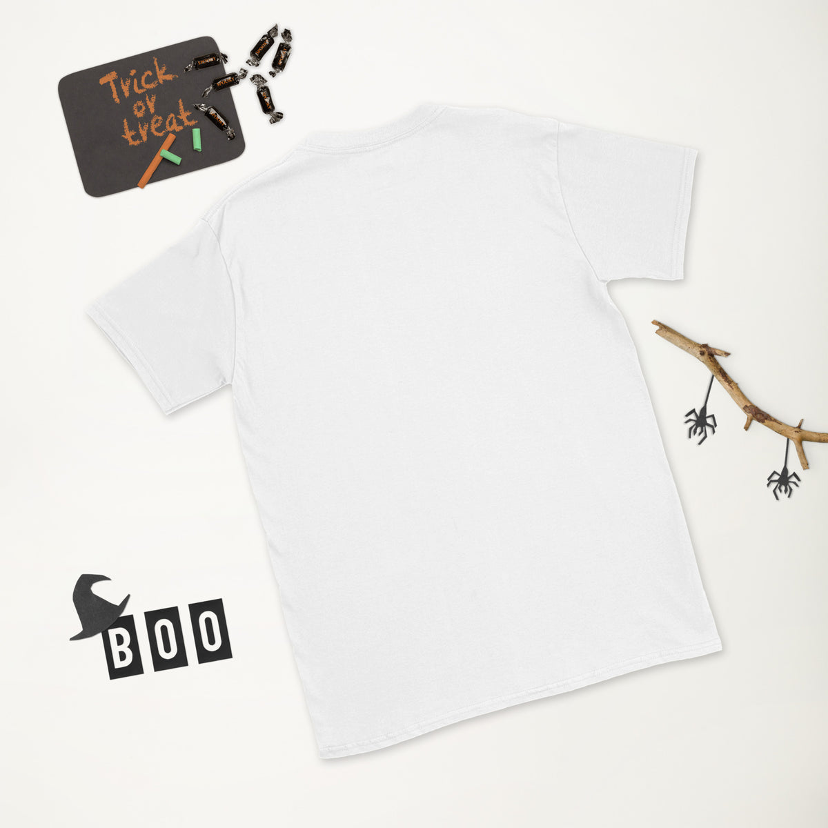 Plain back of white Bonsai Life Co. T-shirt in a white Halloween flat lay