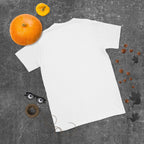 Plain back of white Bonsai Life Co. T-shirt in a gray flat lay with pumpkins