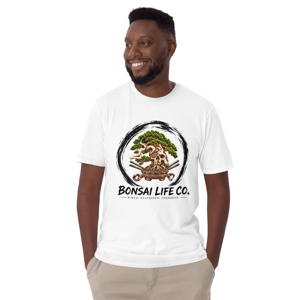 Model wearing white T-shirt with green bonsai and pirate skull graphic inside a black circle with Bonsai Life Co. lettering, front view