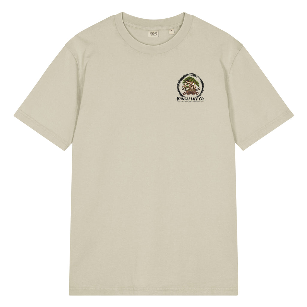 Front of stone beige T-shirt with small circular bonsai pirate skull chest emblem