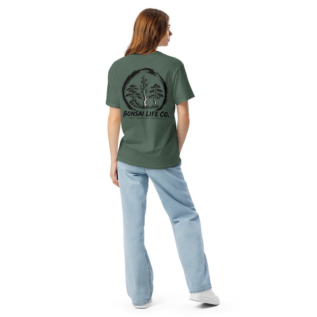 Model showing back of muted blue-green T-shirt with large black Three Trees circle and Bonsai Life Co. lettering