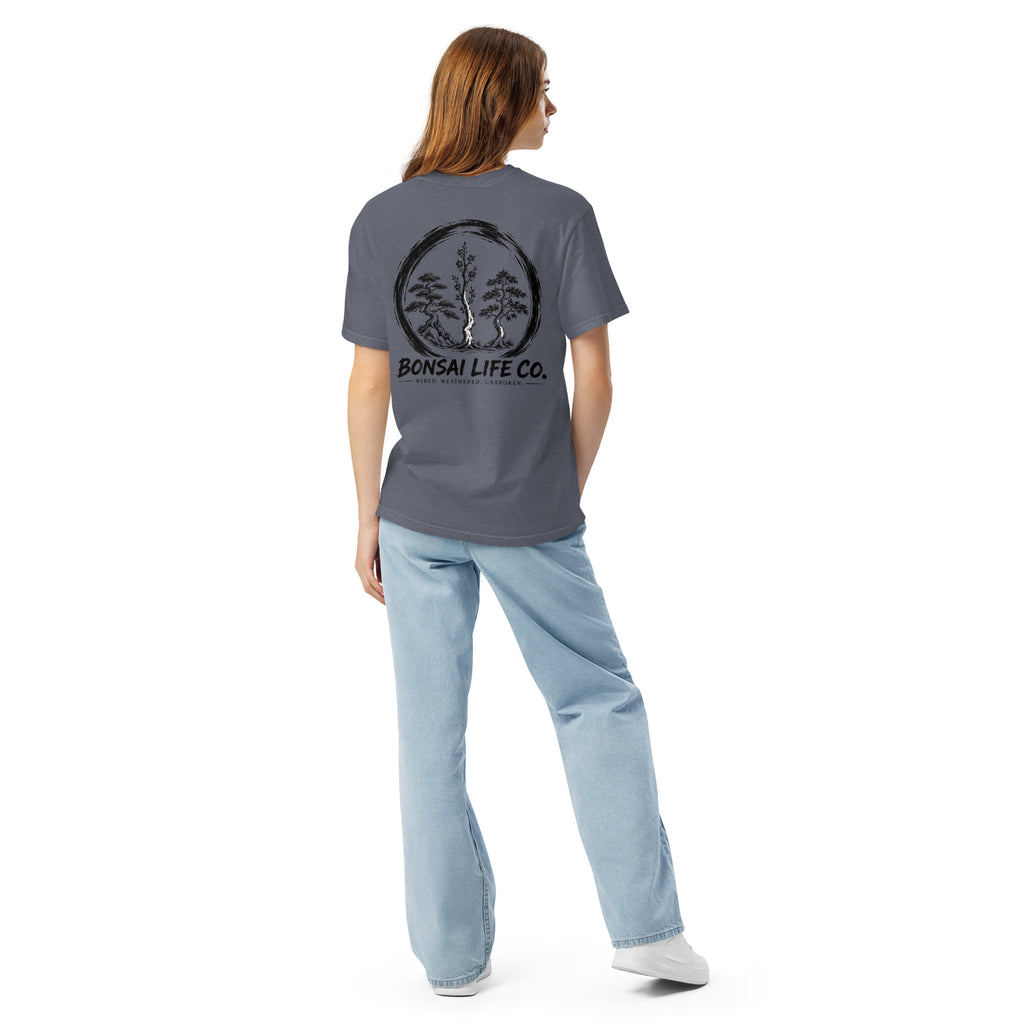 Model showing back of slate blue T-shirt with large black Three Trees circle and Bonsai Life Co. lettering