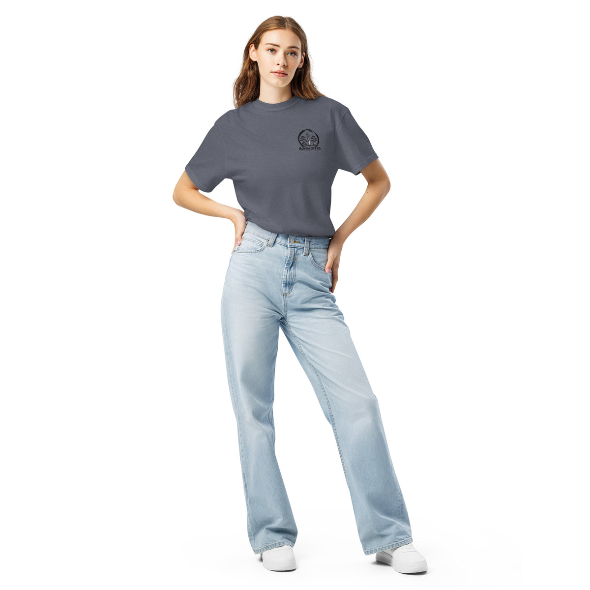 Model wearing slate blue T-shirt with small circular Three Trees chest logo, full-length front view
