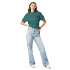 Model wearing teal green T-shirt with small circular Three Trees chest logo, full-length front view