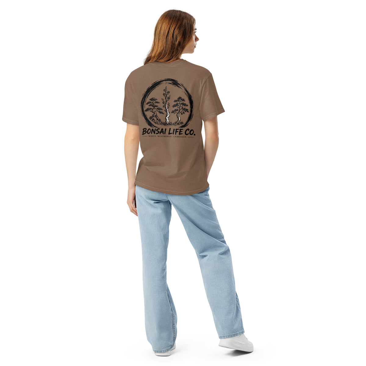 Model showing back of brown T-shirt with large black Three Trees circle and Bonsai Life Co. lettering