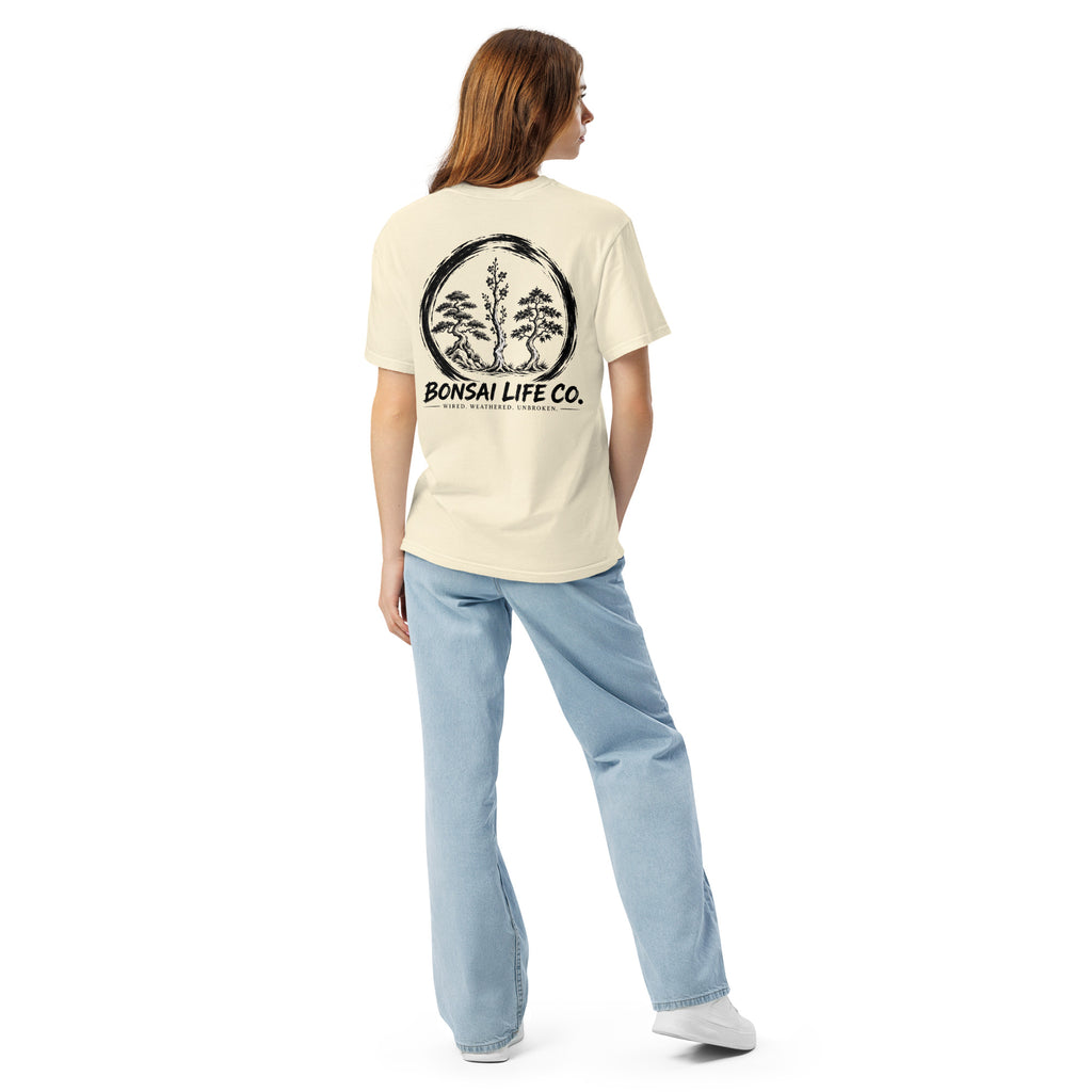 Model showing back of ivory T-shirt with large black Three Trees circle and Bonsai Life Co. lettering