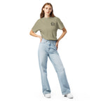 Model wearing khaki beige T-shirt with small circular Three Trees chest logo, full-length front view