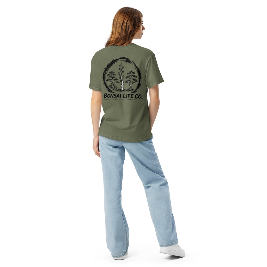 Model showing back of moss green T-shirt with large black Three Trees circle and Bonsai Life Co. lettering