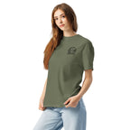 Model wearing moss green T-shirt with small circular Three Trees chest logo, angled front view