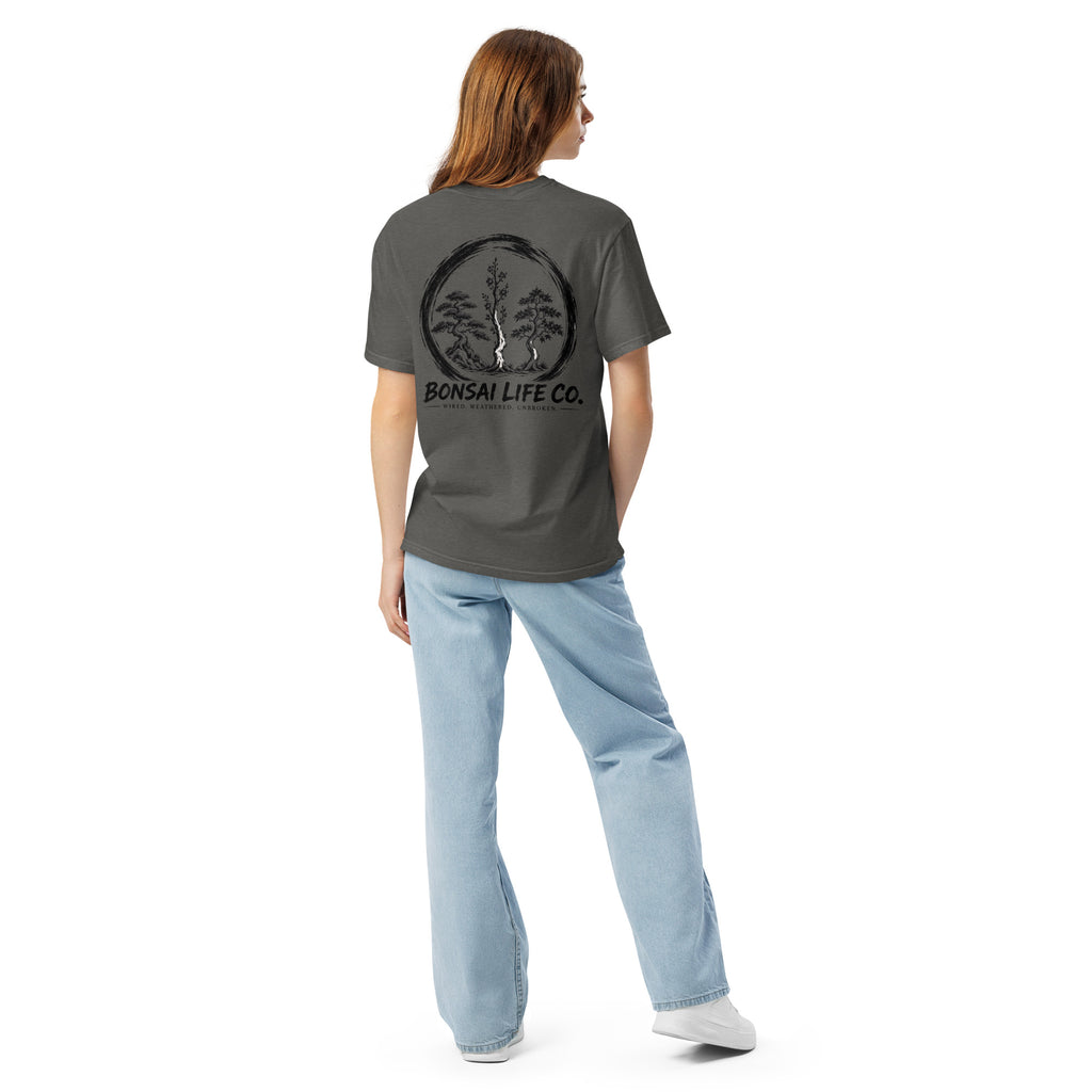 Model showing back of washed charcoal gray T-shirt with large black Three Trees circle and Bonsai Life Co. lettering