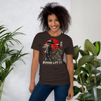 Model wearing dark brown T-shirt with samurai beside a green bonsai and red sun with Bonsai Life Co. lettering, beside leafy plants