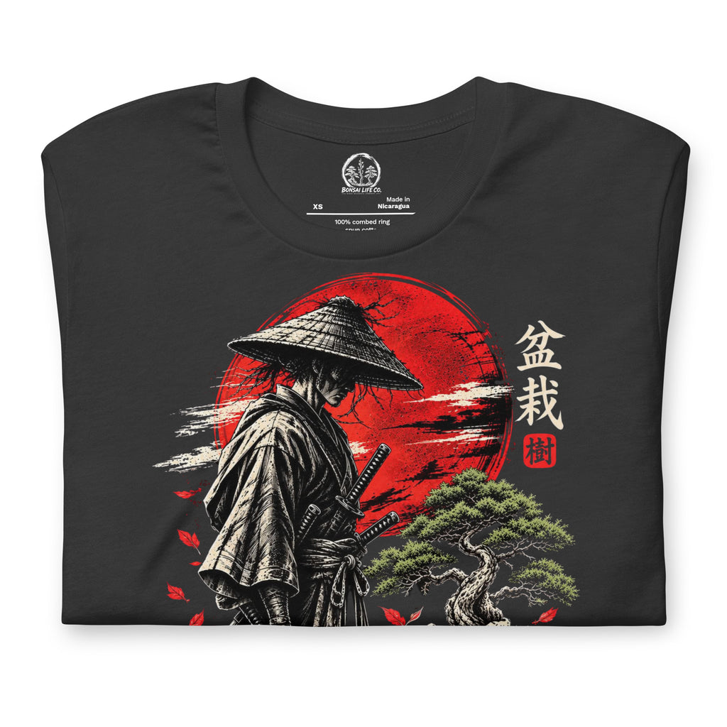Folded dark gray T-shirt showing samurai beside a green bonsai and red sun with Bonsai Life Co. lettering