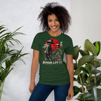 Model wearing forest green T-shirt with samurai beside a green bonsai and red sun with Bonsai Life Co. lettering, beside leafy plants