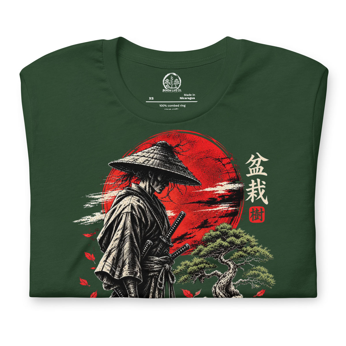 Folded forest green T-shirt showing samurai beside a green bonsai and red sun with Bonsai Life Co. lettering