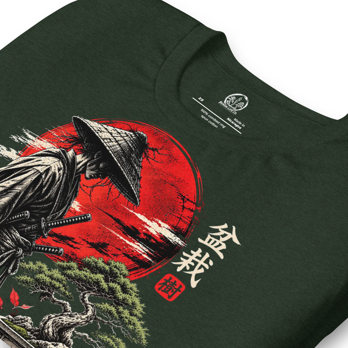 Close-up of samurai beside a green bonsai and red sun with Bonsai Life Co. lettering on heathered dark green T-shirt