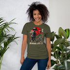 Model wearing muted olive green T-shirt with samurai beside a green bonsai and red sun with Bonsai Life Co. lettering, beside leafy plants