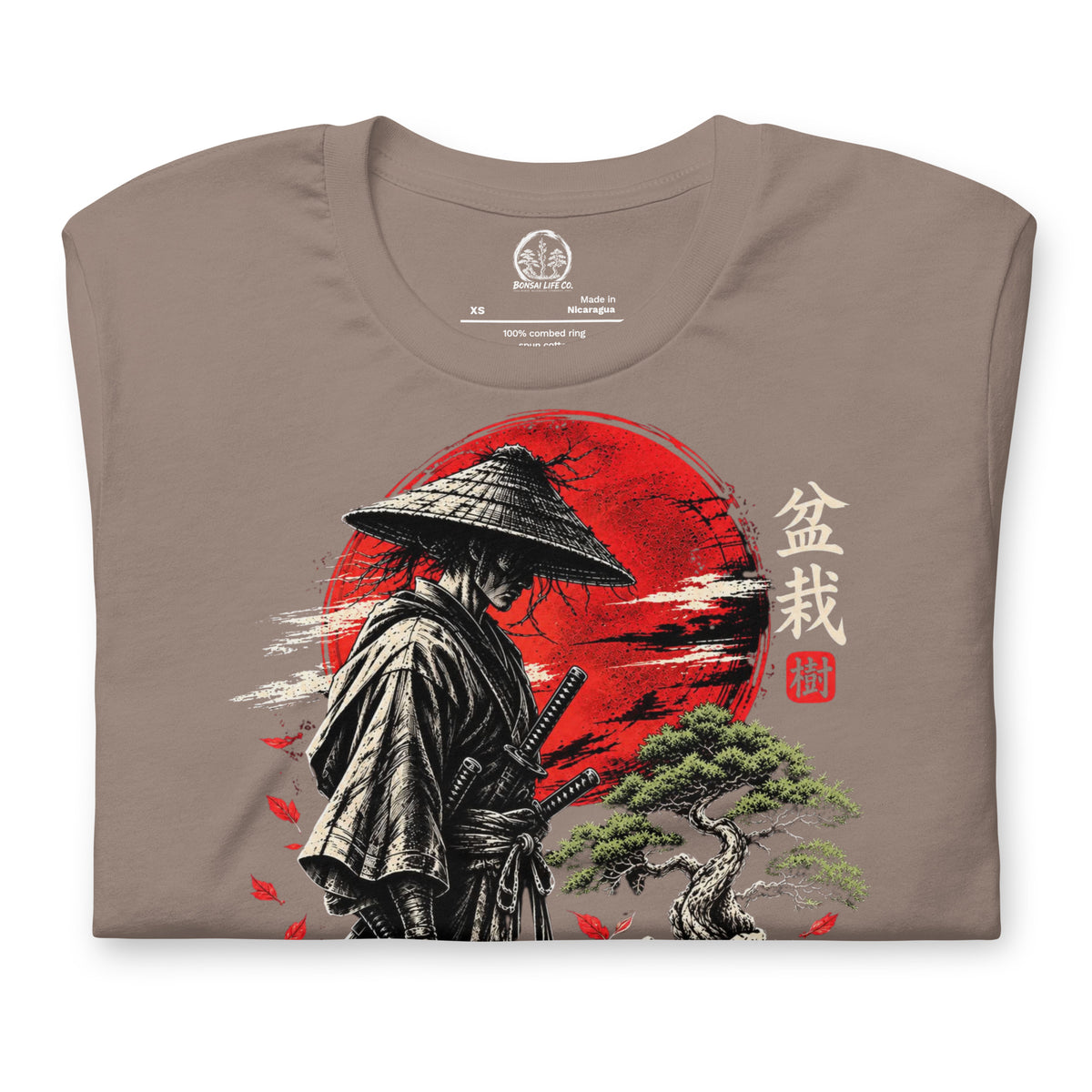 Folded taupe T-shirt showing samurai beside a green bonsai and red sun with Bonsai Life Co. lettering