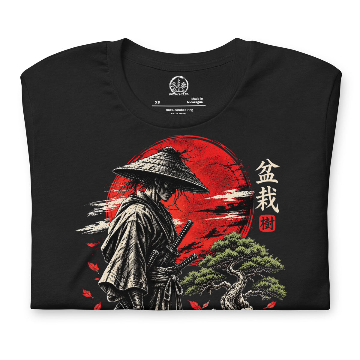 Folded vintage black T-shirt showing samurai beside a green bonsai and red sun with Bonsai Life Co. lettering